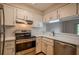 Well-lit kitchen featuring stainless steel appliances, white cabinets, and modern countertops at 1800 Clairmont Lk # A226, Decatur, GA 30033
