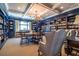 Cozy library with bookshelves, chairs, and a chandelier at 1800 Clairmont Lk # A226, Decatur, GA 30033