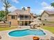 Enjoy outdoor living with a beautiful pool, patio, and screened-in porch at 212 Wilshire Ter, White, GA 30184