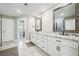 Bathroom featuring double vanity with granite countertop and tile floor at 212 Wilshire Ter, White, GA 30184