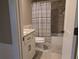 Classic bathroom with a granite vanity, toilet, tub and shower combination, and a framed mirror at 212 Wilshire Ter, White, GA 30184