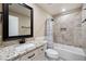 Bathroom featuring single vanity with granite countertop and tiled shower over tub at 212 Wilshire Ter, White, GA 30184