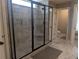 An updated bathroom boasts a glass-enclosed shower with a tiled surround and bench at 212 Wilshire Ter, White, GA 30184