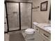 Bathroom featuring tiled shower, a vanity with a granite countertop, and neutral walls at 212 Wilshire Ter, White, GA 30184