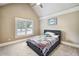 Bedroom featuring a ceiling fan, a window, and a bed with a headboard at 212 Wilshire Ter, White, GA 30184