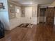 Inviting entryway with rich hardwood floors and decorative accents, welcomes you into the home at 212 Wilshire Ter, White, GA 30184