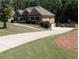 Lovely home boasts a long driveway and a basketball hoop, perfect for Gathering fun at 212 Wilshire Ter, White, GA 30184