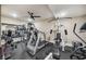 Home gym is equipped with treadmill, weight machines, and mirrored wall at 212 Wilshire Ter, White, GA 30184