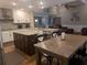 Spacious kitchen with island, stainless appliances, opens to the dining and living areas at 212 Wilshire Ter, White, GA 30184