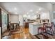 Spacious kitchen with a view of the dining area, offering seating, granite countertops and stainless steel appliances at 212 Wilshire Ter, White, GA 30184