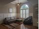 Comfortable living room area featuring a large window, plush seating, and stylish decor at 212 Wilshire Ter, White, GA 30184