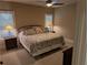 Comfortable main bedroom with neutral tones, a ceiling fan, and large windows at 212 Wilshire Ter, White, GA 30184