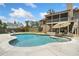 Backyard oasis showcases a sparkling pool and inviting patio furniture at 212 Wilshire Ter, White, GA 30184