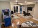 Recreation room with hardwood floors, arcade game, office space and access to other rooms at 212 Wilshire Ter, White, GA 30184