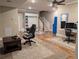 Spacious recreation room featuring hardwood floors, office space, and custom storage at 212 Wilshire Ter, White, GA 30184