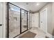 Walk-in shower featuring dual shower heads, mosaic tile accents, and bench at 212 Wilshire Ter, White, GA 30184