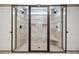 Walk-in shower featuring dual shower heads, mosaic tile accents, and bench at 212 Wilshire Ter, White, GA 30184