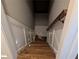 View of a well-lit staircase with a wooden handrail and white trim on walls at 212 Wilshire Ter, White, GA 30184