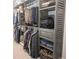 Custom walk-in closet with wooden shelves, drawers, and hanging racks for optimal storage at 212 Wilshire Ter, White, GA 30184