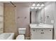 Bathroom with a shower and bathtub combo, white vanity, and toilet at 5207 Merrimont Dr, Alpharetta, GA 30022