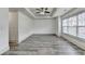 Spacious room with gray floors, bright lighting, and ample space at 5207 Merrimont Dr, Alpharetta, GA 30022
