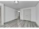 Bedroom with double doors and hardwood style floors at 5207 Merrimont Dr, Alpharetta, GA 30022