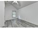 Bright bedroom features gray flooring and a vaulted ceiling with a ceiling fan at 5207 Merrimont Dr, Alpharetta, GA 30022
