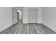 Bedroom featuring double doors and hardwood style floors at 5207 Merrimont Dr, Alpharetta, GA 30022