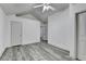 Bright bedroom features gray flooring and a vaulted ceiling with multiple closets at 5207 Merrimont Dr, Alpharetta, GA 30022