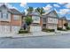 Charming brick townhomes with two-car garages, landscaped front yards, and inviting curb appeal at 5207 Merrimont Dr, Alpharetta, GA 30022
