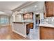 Kitchen with breakfast bar, granite countertops, and stainless steel appliances at 5207 Merrimont Dr, Alpharetta, GA 30022