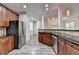 Bright kitchen featuring granite counters, stainless appliances and an open layout at 5207 Merrimont Dr, Alpharetta, GA 30022