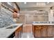 Modern kitchen includes stainless sink, granite counters, and mosaic backsplash at 5207 Merrimont Dr, Alpharetta, GA 30022