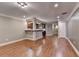 Bright living area showcasing hardwood floors, recessed lighting, and open flow at 5207 Merrimont Dr, Alpharetta, GA 30022