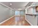 Open-concept living room offers hardwood floors, crown molding, and recessed lighting at 5207 Merrimont Dr, Alpharetta, GA 30022