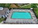 Overhead view of a community pool with lounge chairs and gated fence at 5207 Merrimont Dr, Alpharetta, GA 30022