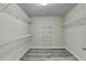 Walk-in closet with gray floor and wire shelving at 5207 Merrimont Dr, Alpharetta, GA 30022