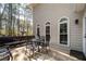 View of back deck with arched windows, table and chairs plus door to house at , Lilburn, GA 30047