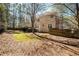 Large fenced backyard with mature trees offering privacy and space for outdoor activities at , Lilburn, GA 30047