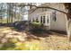 View of backyard with deck, bay window and large, mature trees at , Lilburn, GA 30047