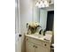 Well-lit bathroom with a single sink vanity and neutral finishes at , Lilburn, GA 30047