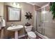 Simple bathroom with a pedestal sink, toilet, and shower with glass door at , Lilburn, GA 30047