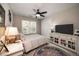 Neutral bedroom featuring a ceiling fan, white furnishings, and soft decor at , Lilburn, GA 30047