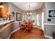 Charming dining area features a bay window, chandelier, and hardwood floors at , Lilburn, GA 30047