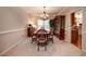 Formal dining room with wooden furniture, soft lighting, and elegant decor at , Lilburn, GA 30047