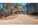 Inviting two-story brick home with manicured front lawn and mature trees at , Lilburn, GA 30047