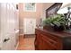 Bright foyer features hardwood floors, a high ceiling, and an elegant wooden accent table at , Lilburn, GA 30047