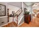 Hallway view of carpeted stairs and kitchen, with hardwood floors in the entry at , Lilburn, GA 30047