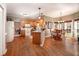 Open kitchen boasts granite counters, modern appliances, and hardwood floors, and views to the breakfast nook at , Lilburn, GA 30047