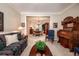 Comfortable living room with a decorative piano, furnishings, and views to the dining area at , Lilburn, GA 30047